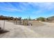Gated entrance to a desert home with solar panels and mountain views at 38820 N 19Th Way, Phoenix, AZ 85086