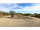 Gravel driveway leading to a single-Gathering home in a desert setting at 38820 N 19Th Way, Phoenix, AZ 85086