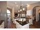 Modern kitchen with white cabinets, an island with dark granite countertops, and stainless steel appliances at 38820 N 19Th Way, Phoenix, AZ 85086