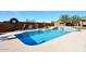 Inviting pool with diving board, waterfall feature, and surrounding patio at 38820 N 19Th Way, Phoenix, AZ 85086