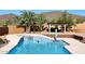 Pool with a hot tub, covered patio, and mountain views at 38820 N 19Th Way, Phoenix, AZ 85086