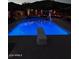 Relaxing pool area with diving board at night at 38820 N 19Th Way, Phoenix, AZ 85086