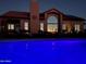 Luxury home with a beautiful pool at night at 38820 N 19Th Way, Phoenix, AZ 85086