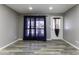 Living room with wood-look floors, neutral walls and window at 507 E Judi Dr, Casa Grande, AZ 85122