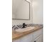 Updated bathroom with a butcher block vanity and black fixtures at 3411 N 12Th Pl # 9, Phoenix, AZ 85014