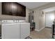 Laundry room with washer, dryer, and cabinets for storage at 15019 N Mayflower Dr, Fountain Hills, AZ 85268