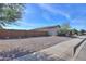 Single-story home with a gravel front yard and a brown block wall at 1619 E Joelle Dr, Casa Grande, AZ 85122