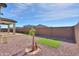 Landscaped backyard with artificial turf and gravel at 1619 E Joelle Dr, Casa Grande, AZ 85122