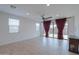 Bright living room with tile floors and sliding glass doors leading to a patio at 1619 E Joelle Dr, Casa Grande, AZ 85122