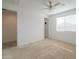 Bright bedroom with carpeted floor and ceiling fan at 1619 E Joelle Dr, Casa Grande, AZ 85122