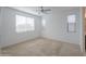 Spacious bedroom with carpeted floor and ceiling fan at 1619 E Joelle Dr, Casa Grande, AZ 85122