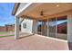 Covered patio with sliding glass doors and ceiling fan at 1619 E Joelle Dr, Casa Grande, AZ 85122