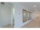 Light-filled hallway with tile floors and mirrors at 1619 E Joelle Dr, Casa Grande, AZ 85122