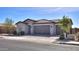 Single-story house with three-car garage and brick driveway at 1619 E Joelle Dr, Casa Grande, AZ 85122