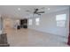 Bright living room with tile floors and a ceiling fan at 1619 E Joelle Dr, Casa Grande, AZ 85122
