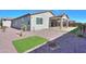 Artificial turf and gravel backyard with desert landscaping at 1619 E Joelle Dr, Casa Grande, AZ 85122