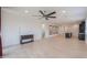 Open living room, tile floors, kitchen view at 1619 E Joelle Dr, Casa Grande, AZ 85122