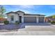 Single-story house with a three-car garage and landscaping at 1619 E Joelle Dr, Casa Grande, AZ 85122