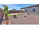 Artificial turf and gravel backyard with desert landscaping at 1619 E Joelle Dr, Casa Grande, AZ 85122