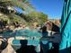 Relaxing pool with palm trees and lounge chairs at 2311 E Coconino Dr, Chandler, AZ 85249