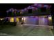 Two story house with colorful night lighting at 2311 E Coconino Dr, Chandler, AZ 85249