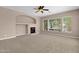 Living room with a fireplace and large windows at 16209 S 29Th Ave, Phoenix, AZ 85045