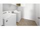 Convenient laundry room with washer and dryer hookups at 5239 E Iridium Way, San Tan Valley, AZ 85143