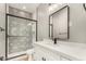 Stylish bathroom with patterned tile shower and modern vanity at 569 S May Pl, Casa Grande, AZ 85194