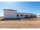 Rear view of a modern house with a flat roof at 569 S May Pl, Casa Grande, AZ 85194