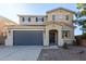 Two-story house with a gray double garage door at 38318 N La Grange Ln, San Tan Valley, AZ 85140