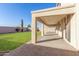 Covered patio overlooks a well-manicured grassy backyard at 38318 N La Grange Ln, San Tan Valley, AZ 85140