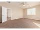 Bedroom with carpet, ceiling fan, and access to hallway at 38318 N La Grange Ln, San Tan Valley, AZ 85140