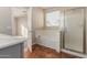 Clean bathroom features a shower/tub combo and linen closet at 38318 N La Grange Ln, San Tan Valley, AZ 85140