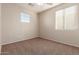Charming bedroom with two windows and a ceiling fan at 38318 N La Grange Ln, San Tan Valley, AZ 85140
