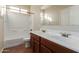 Bathroom boasts double sinks, a shower, and a bathtub at 38318 N La Grange Ln, San Tan Valley, AZ 85140