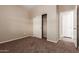 Bright bedroom with a mirrored closet and neutral walls at 38318 N La Grange Ln, San Tan Valley, AZ 85140