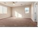 Spacious bedroom with carpet, window, and ceiling fan at 38318 N La Grange Ln, San Tan Valley, AZ 85140