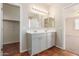 Bright bathroom boasts double sinks, a shower, and a separate tub at 38318 N La Grange Ln, San Tan Valley, AZ 85140