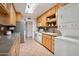 Well-equipped kitchen featuring wood cabinets and stainless steel appliances at 10623 W El Rancho Dr, Sun City, AZ 85351