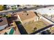 Aerial view of the house's backyard, highlighting a grassy area, pool, and patio at 1621 W Stottler Dr, Chandler, AZ 85224