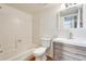 Bathroom with tub/shower, toilet, and wood vanity at 222 W Brown Rd # 117, Mesa, AZ 85201