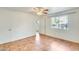 Bedroom with tile floors, ceiling fan, and exterior view at 222 W Brown Rd # 117, Mesa, AZ 85201