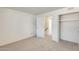 Bedroom with carpet, closet, and access to hallway at 222 W Brown Rd # 117, Mesa, AZ 85201