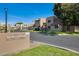 Community entrance with signage and landscaping at 222 W Brown Rd # 117, Mesa, AZ 85201