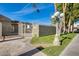 Gated entrance to community with grassy areas at 222 W Brown Rd # 117, Mesa, AZ 85201