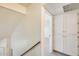 White hallway with access to bedrooms and linen closet at 222 W Brown Rd # 117, Mesa, AZ 85201