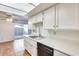 Kitchen features white cabinets, stainless steel appliances, and access to patio at 222 W Brown Rd # 117, Mesa, AZ 85201