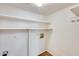 Laundry area with shelving and hook for storage at 222 W Brown Rd # 117, Mesa, AZ 85201