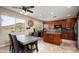 Well-equipped kitchen with wooden cabinets, granite countertops, and an island at 26703 N 51St Dr, Phoenix, AZ 85083