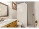 Bathroom with a walk-in shower and wood vanity at 3498 N Morningside Rd, Apache Junction, AZ 85119